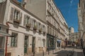 People, building and blue sky on street of Montmartre at Paris